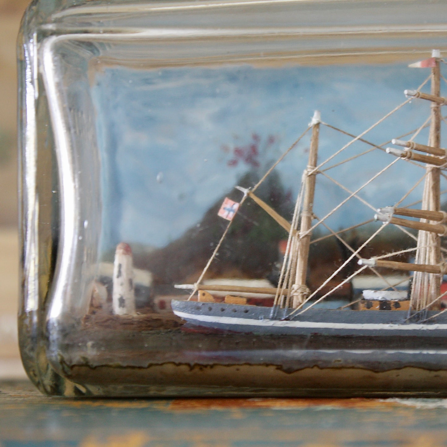 
                  
                    a ship in a bottle with volcano.
                  
                