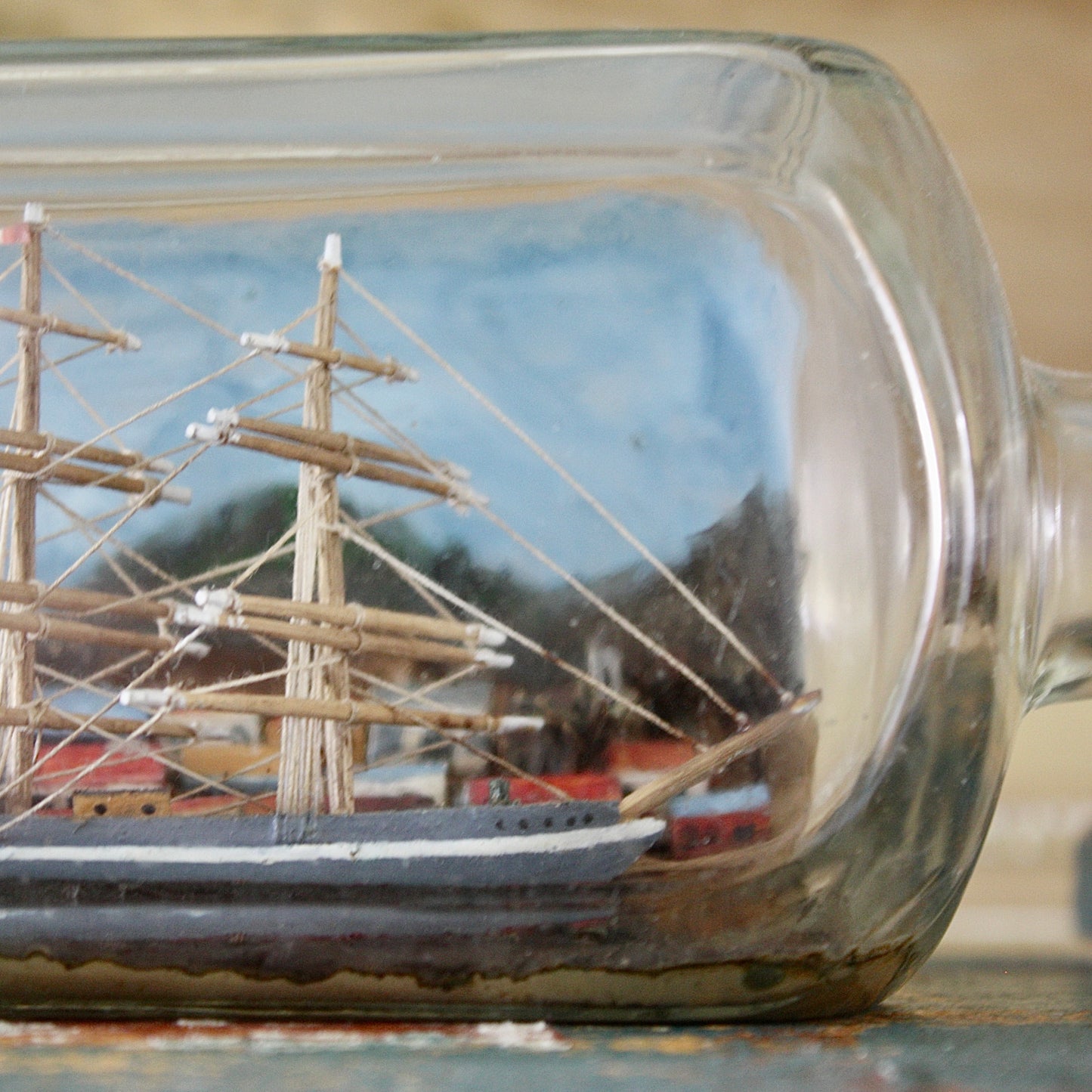
                  
                    a ship in a bottle with volcano.
                  
                