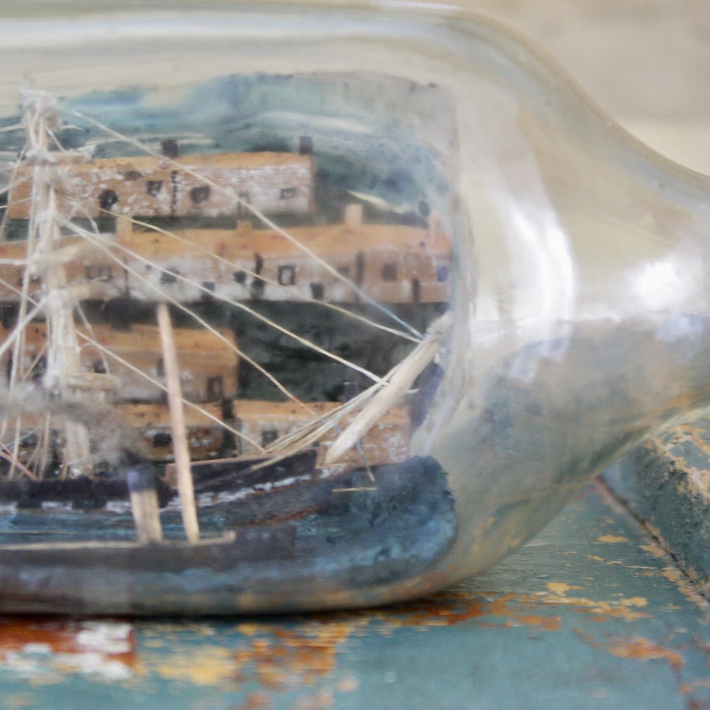 
                  
                    a ship in a walkers whisky bottle,
                  
                