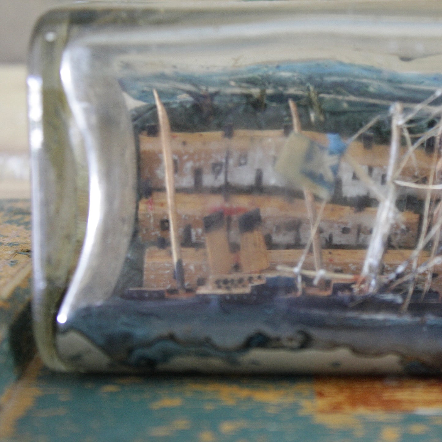 
                  
                    a ship in a walkers whisky bottle,
                  
                