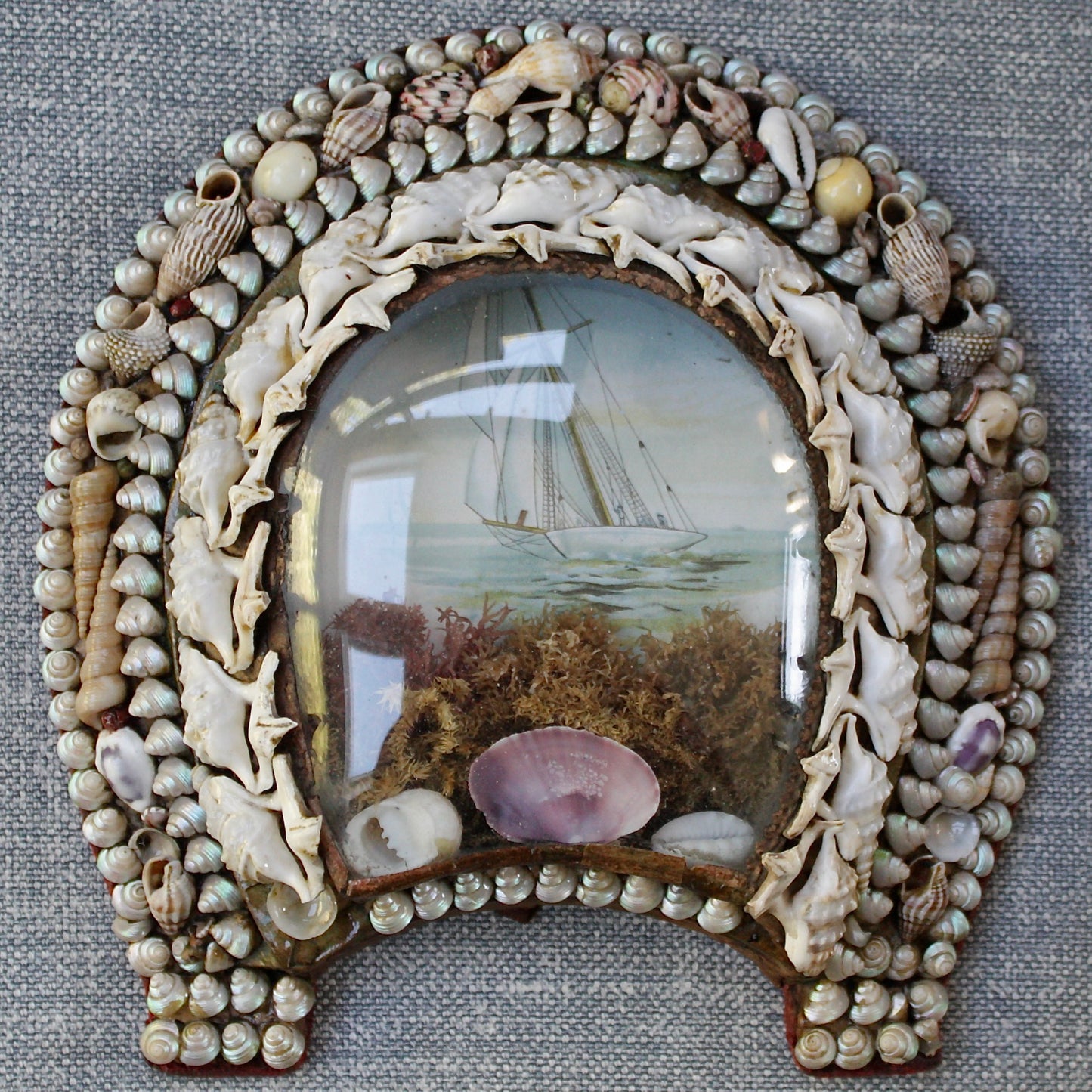 
                  
                    an antique victorian keep sake love token, shell sailors valentine lucky horseshoe.
                  
                