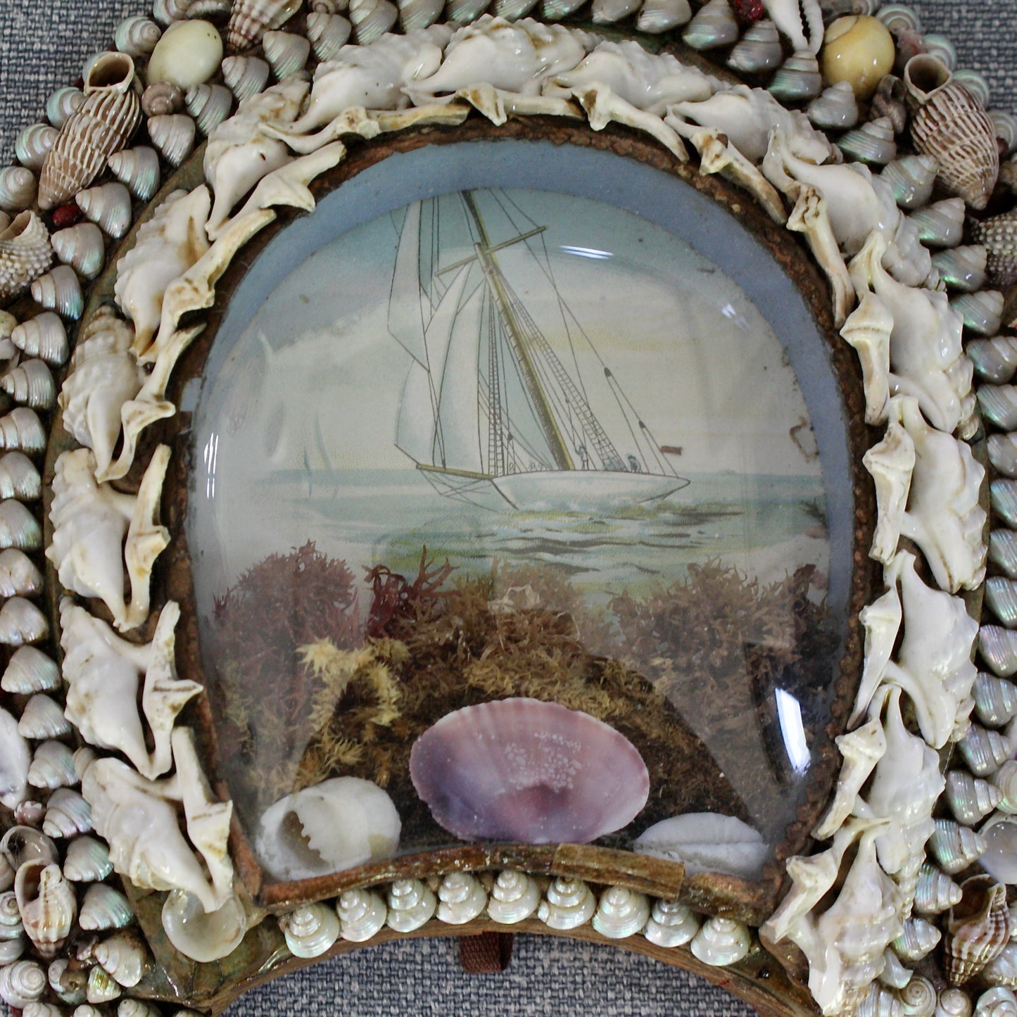 
                  
                    an antique victorian keep sake love token, shell sailors valentine lucky horseshoe.
                  
                