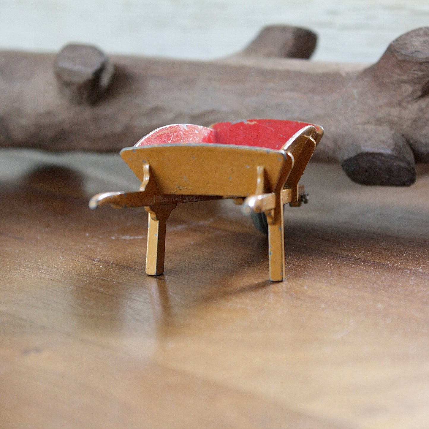 
                  
                    a miniature wheelbarrow.
                  
                