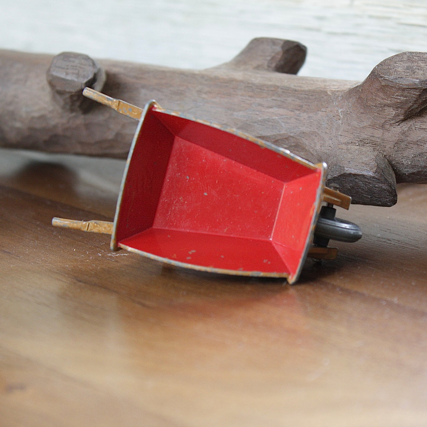 
                  
                    a miniature wheelbarrow.
                  
                