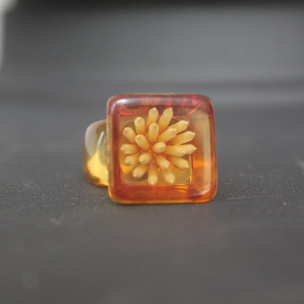
                  
                    ring of amber perspex
                  
                