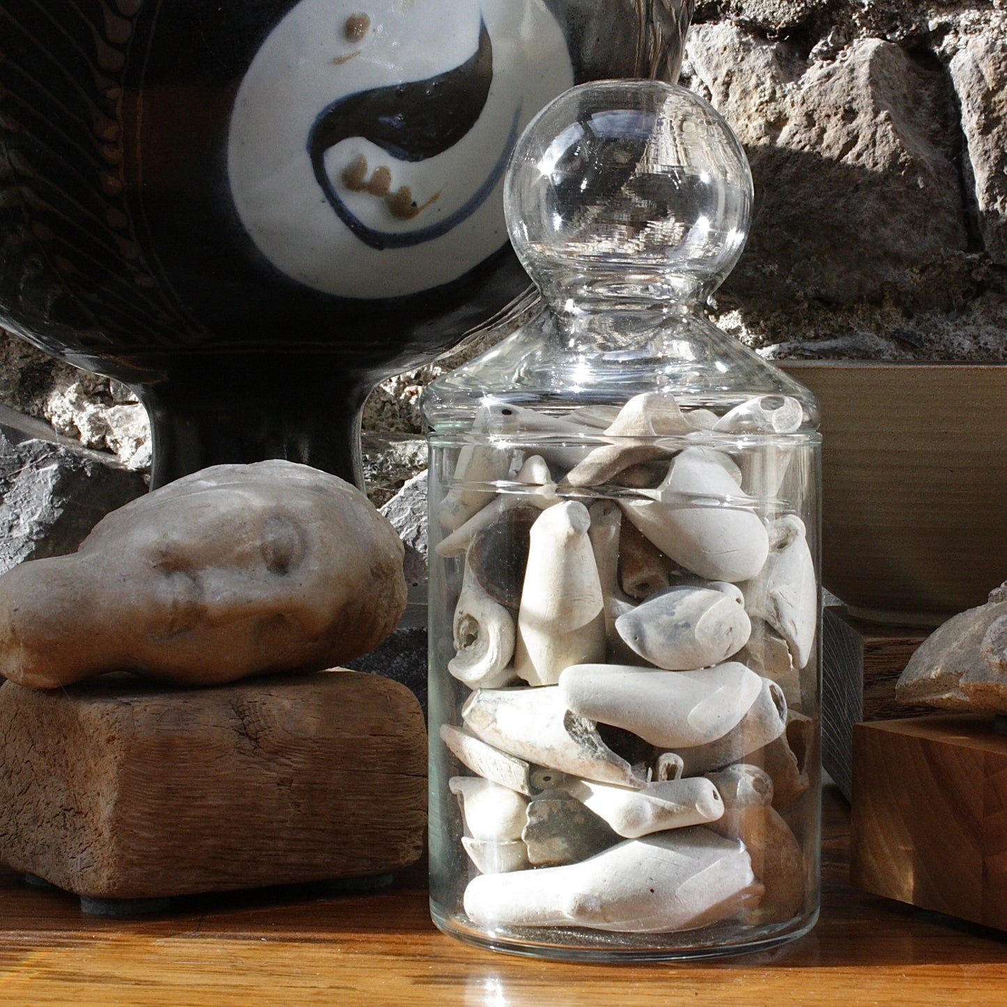 
                  
                    a jar of  18th/19th century clay tobacco pipe bowls.
                  
                
