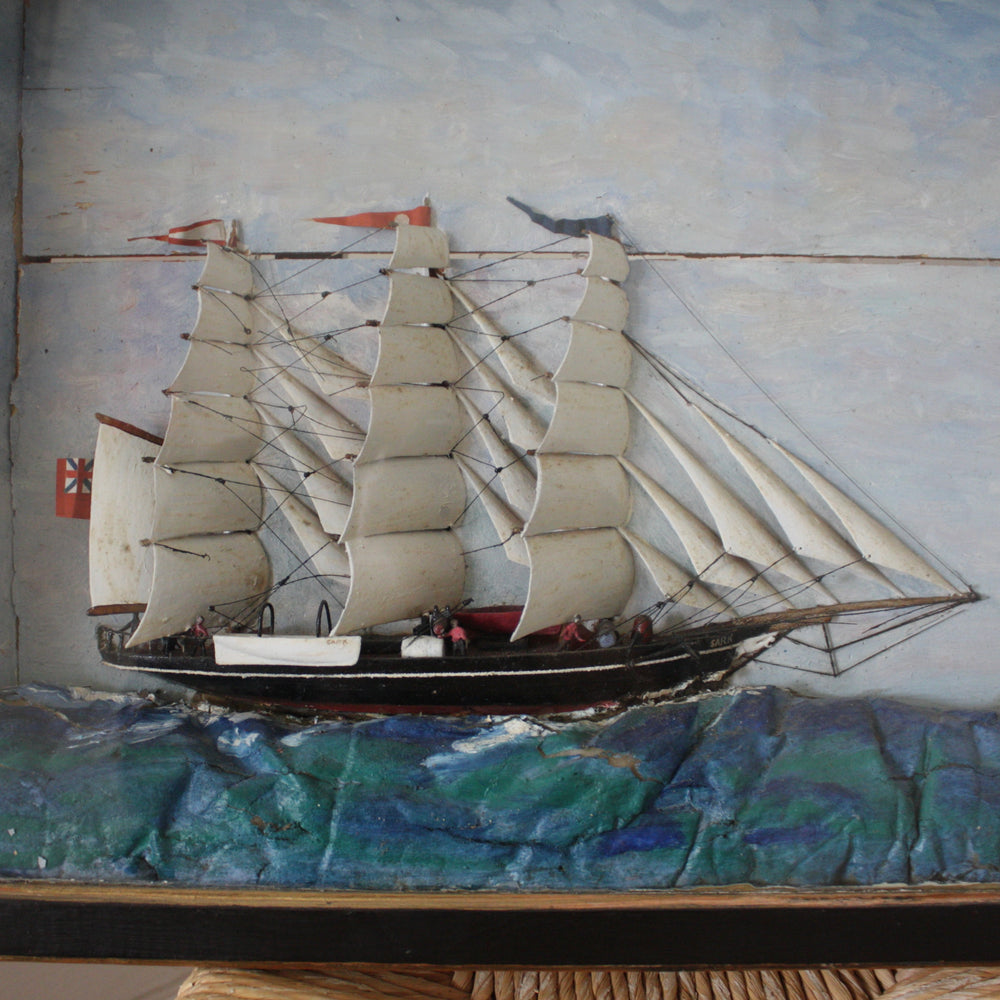 
                  
                    an antique folk art sailor made diorama or shadowbox
                  
                