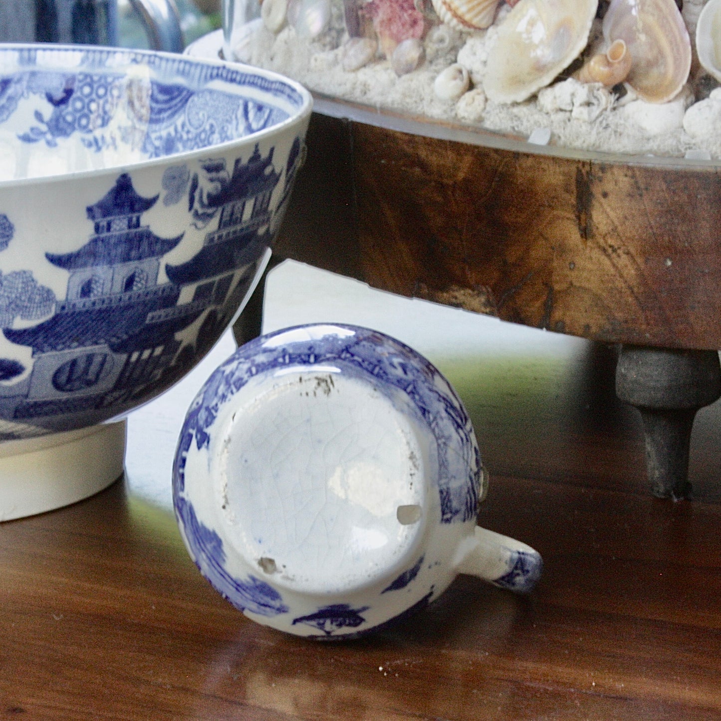 
                  
                    a small antique willow pattern transferware jug.
                  
                