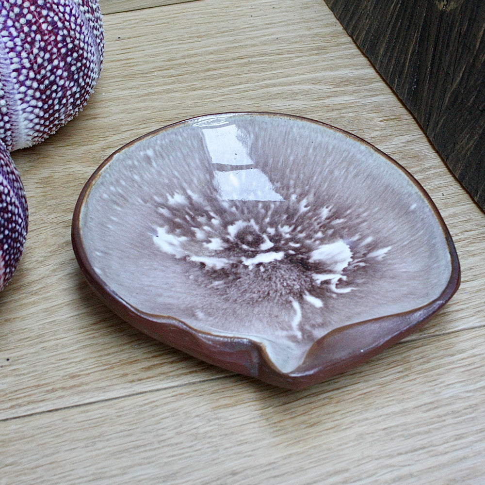 a studio pottery dish fashioned as a life size mother of pearl shell by humfrey wakefield.