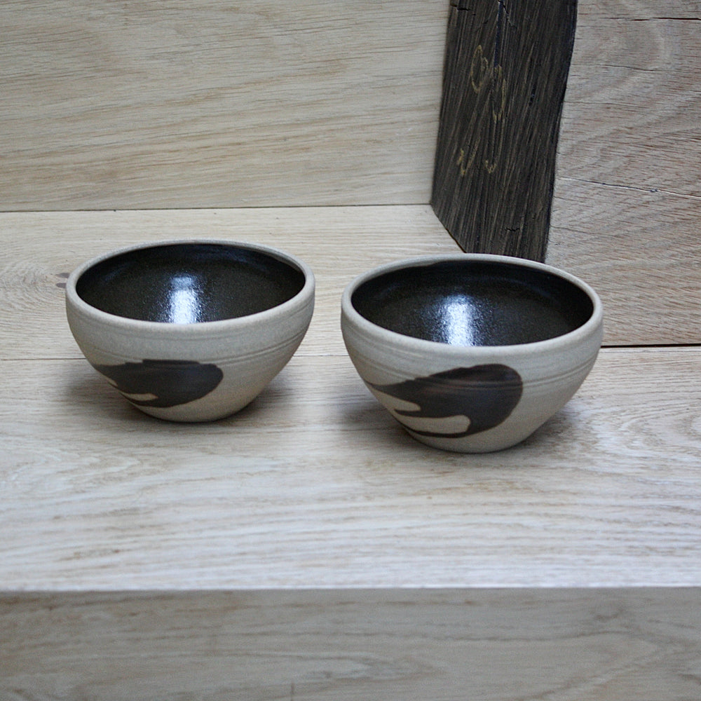 
                  
                    a pair of studio pottery bowls by alan brough.
                  
                