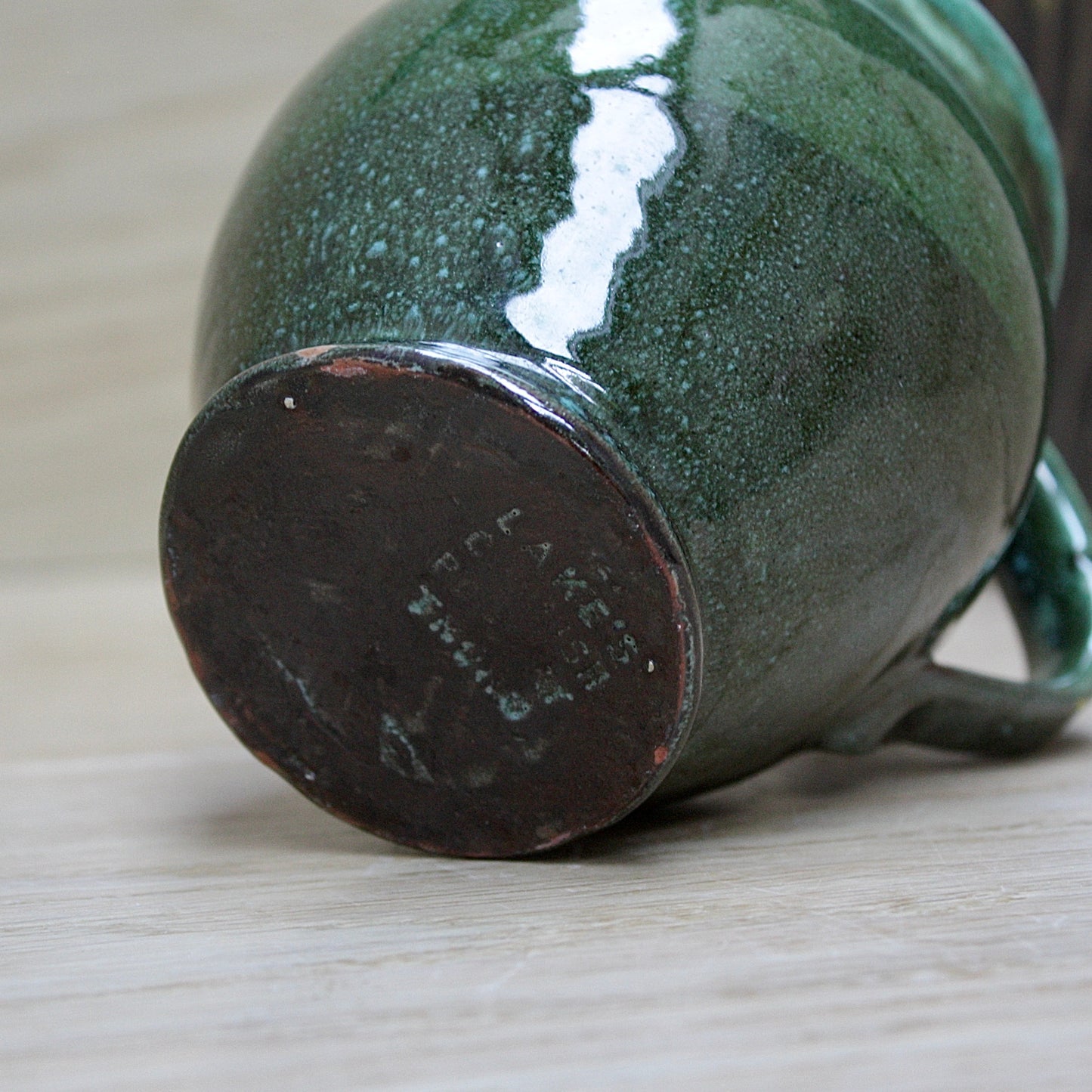 
                  
                    a lakes Cornish pottery Truro green jug.
                  
                