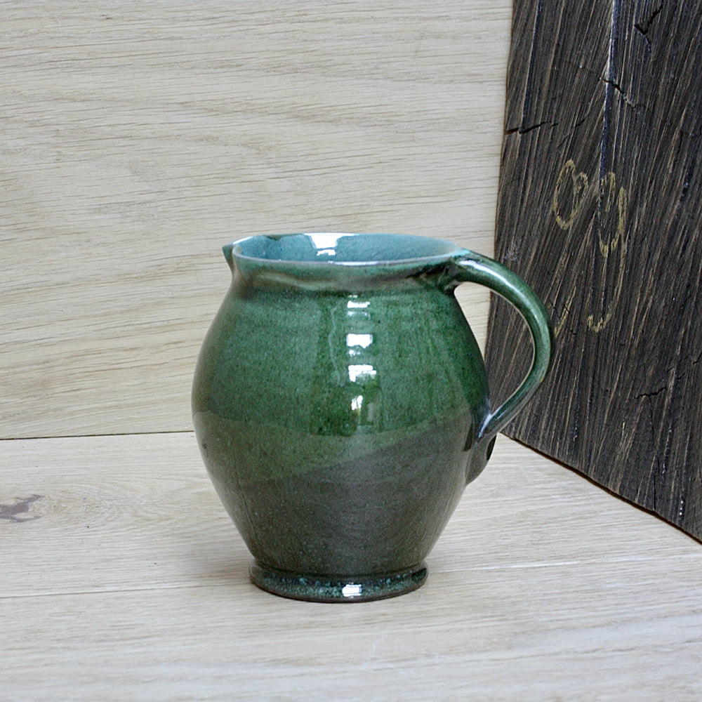 
                  
                    a lakes Cornish pottery Truro green jug.
                  
                