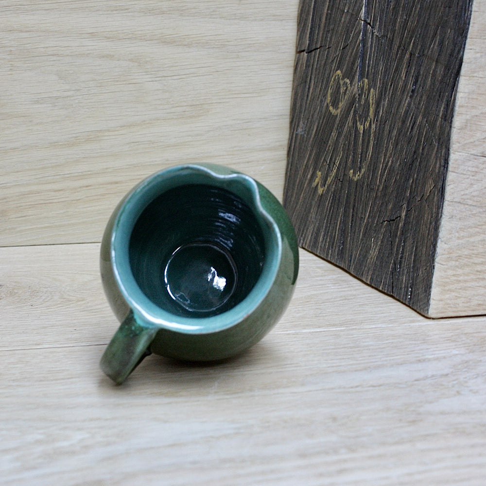 
                  
                    a lakes Cornish pottery Truro green jug.
                  
                