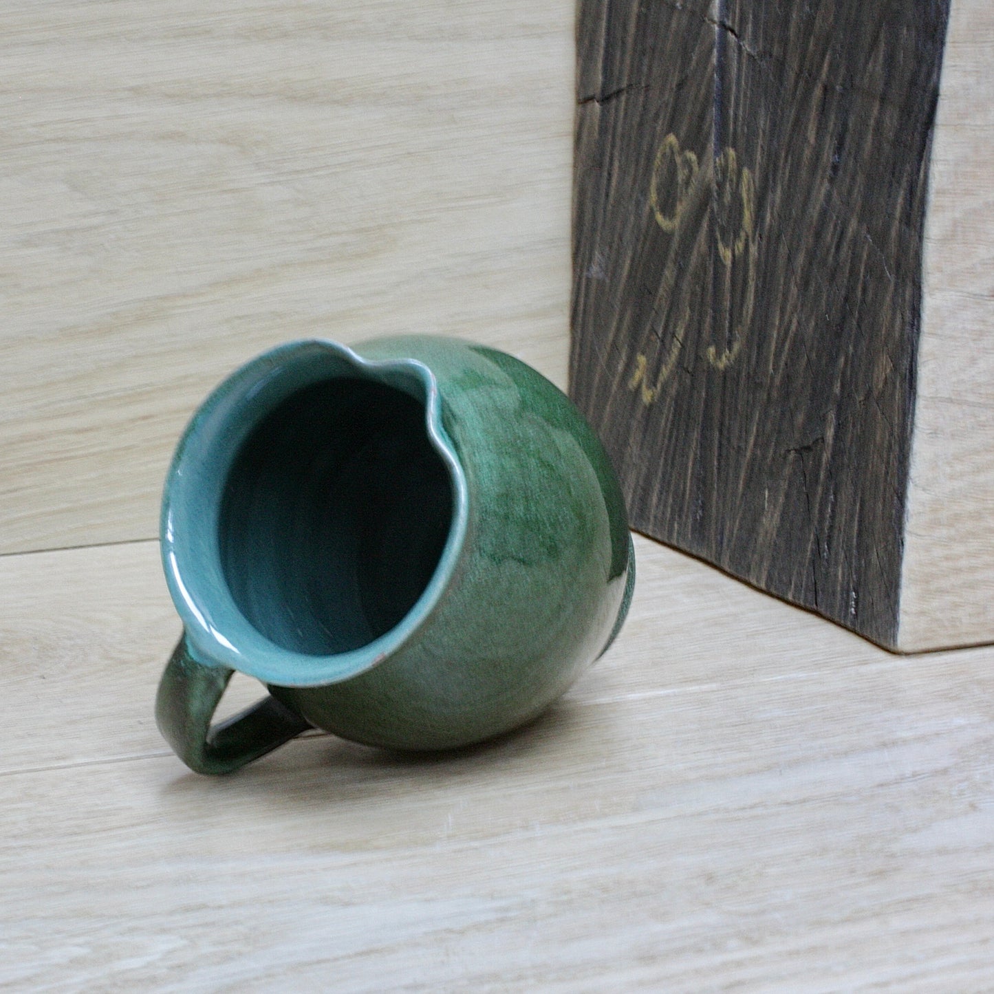 
                  
                    a lakes Cornish pottery Truro green jug.
                  
                