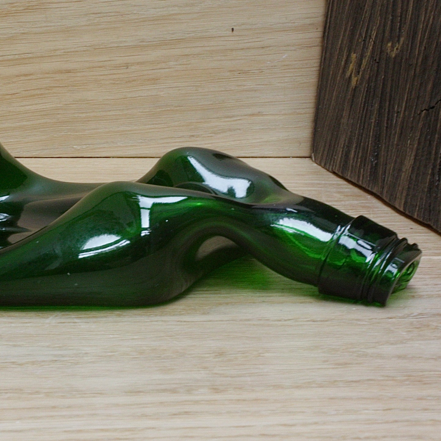 
                  
                    "the squashed bottle " by  reg moon
                  
                