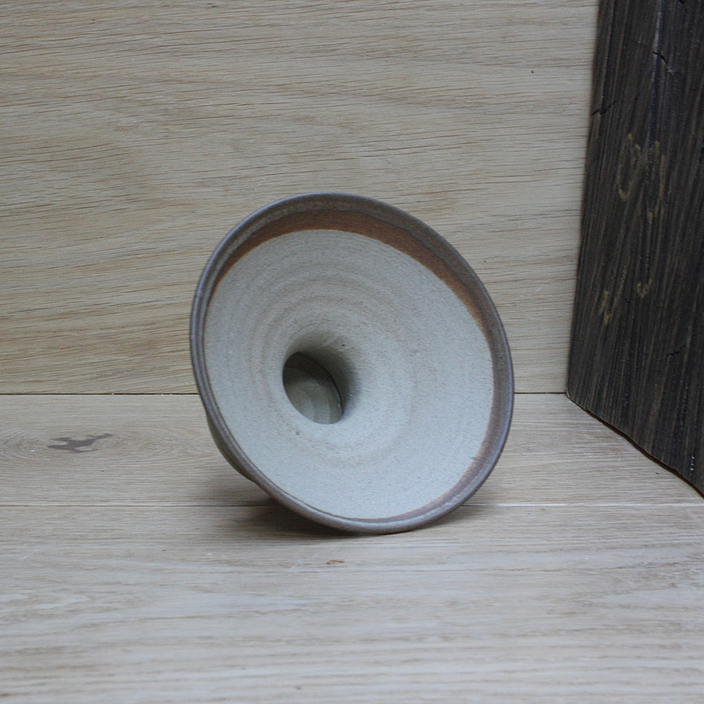 
                  
                    a salt glaze candle holder by Susan Bennett.
                  
                