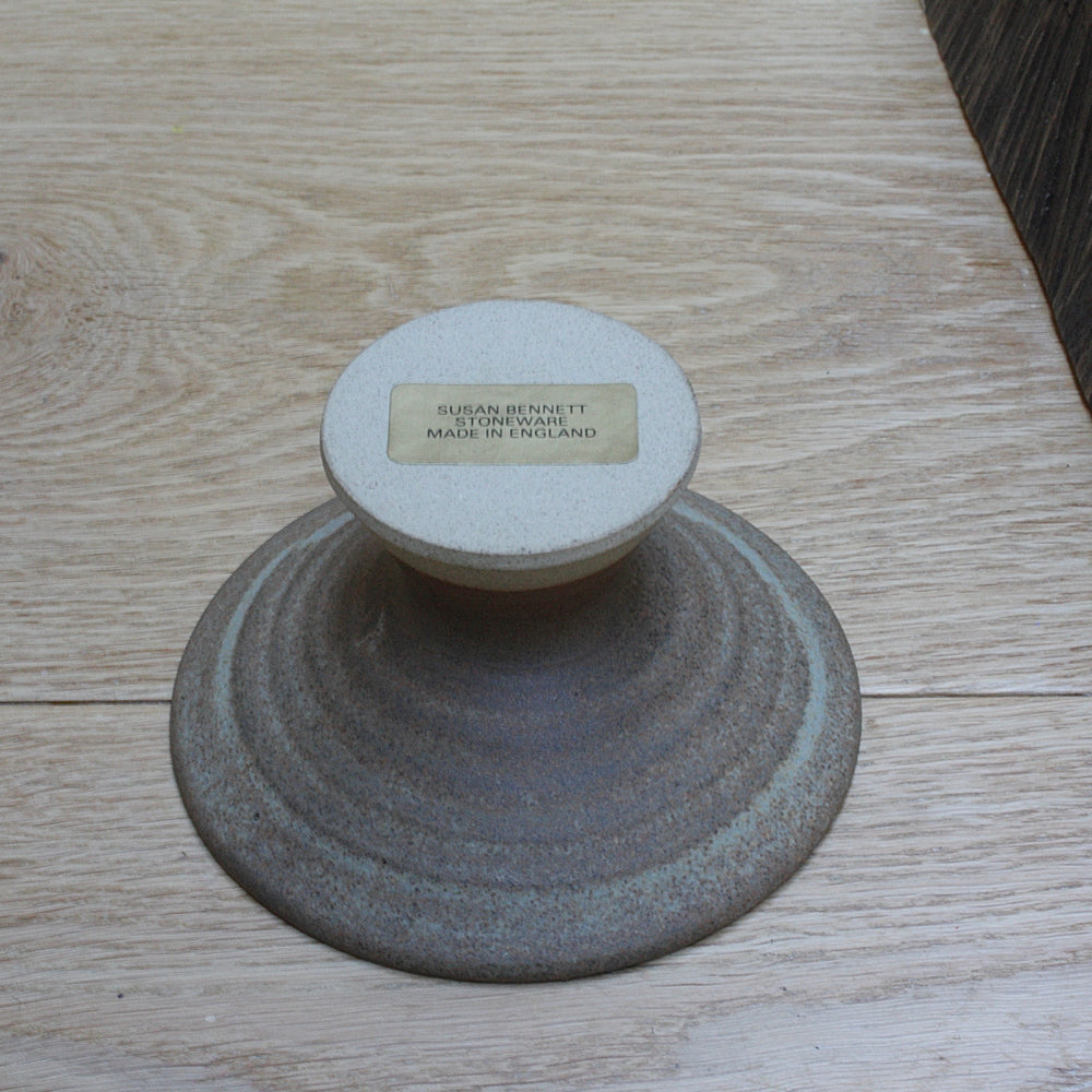 
                  
                    a salt glaze candle holder by Susan Bennett.
                  
                