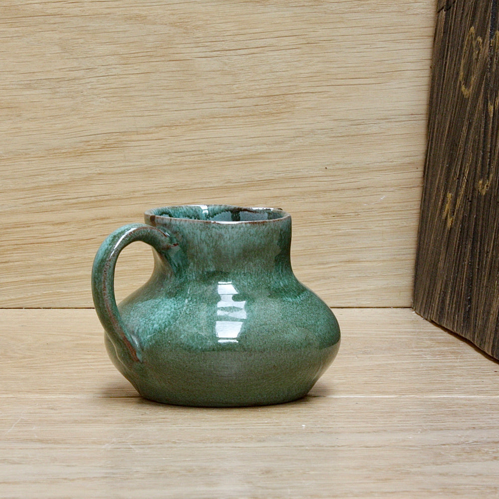 a small stocky lakes Cornish pottery Truro cream jug.