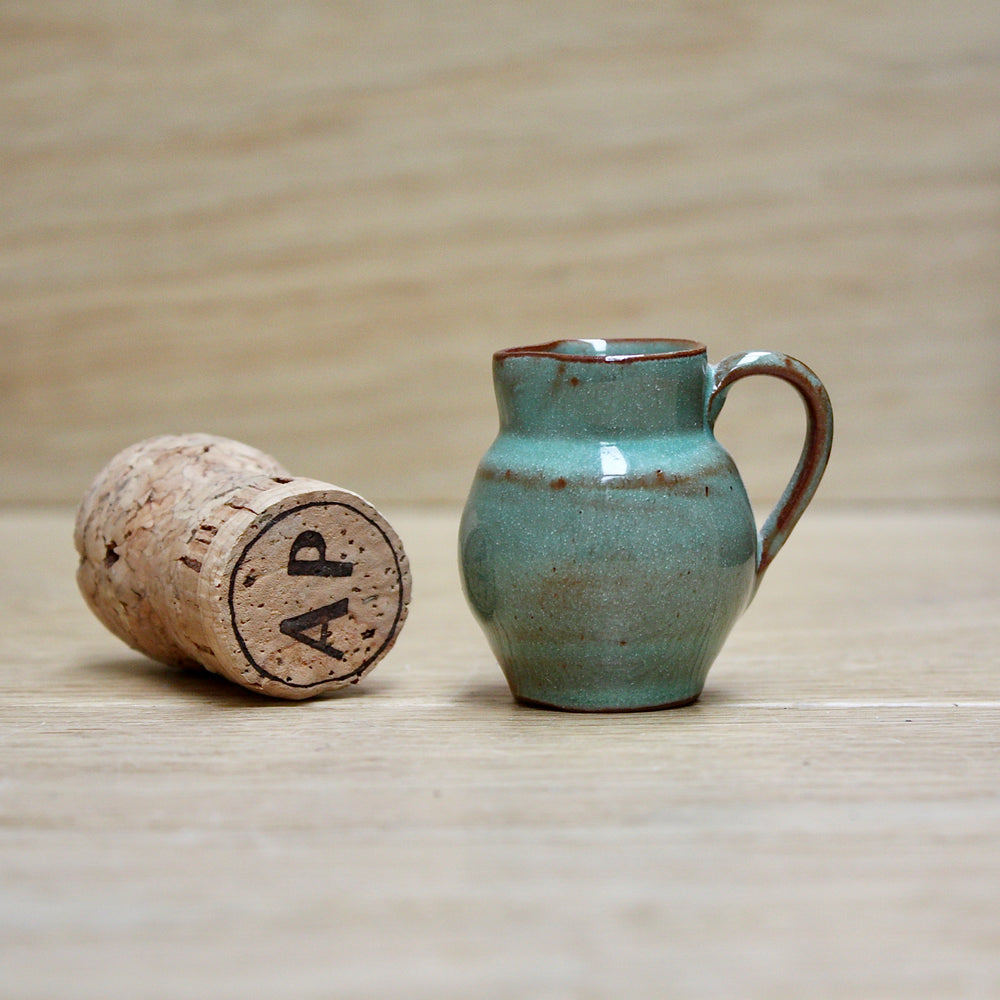 a miniature lakes pottery cream jug