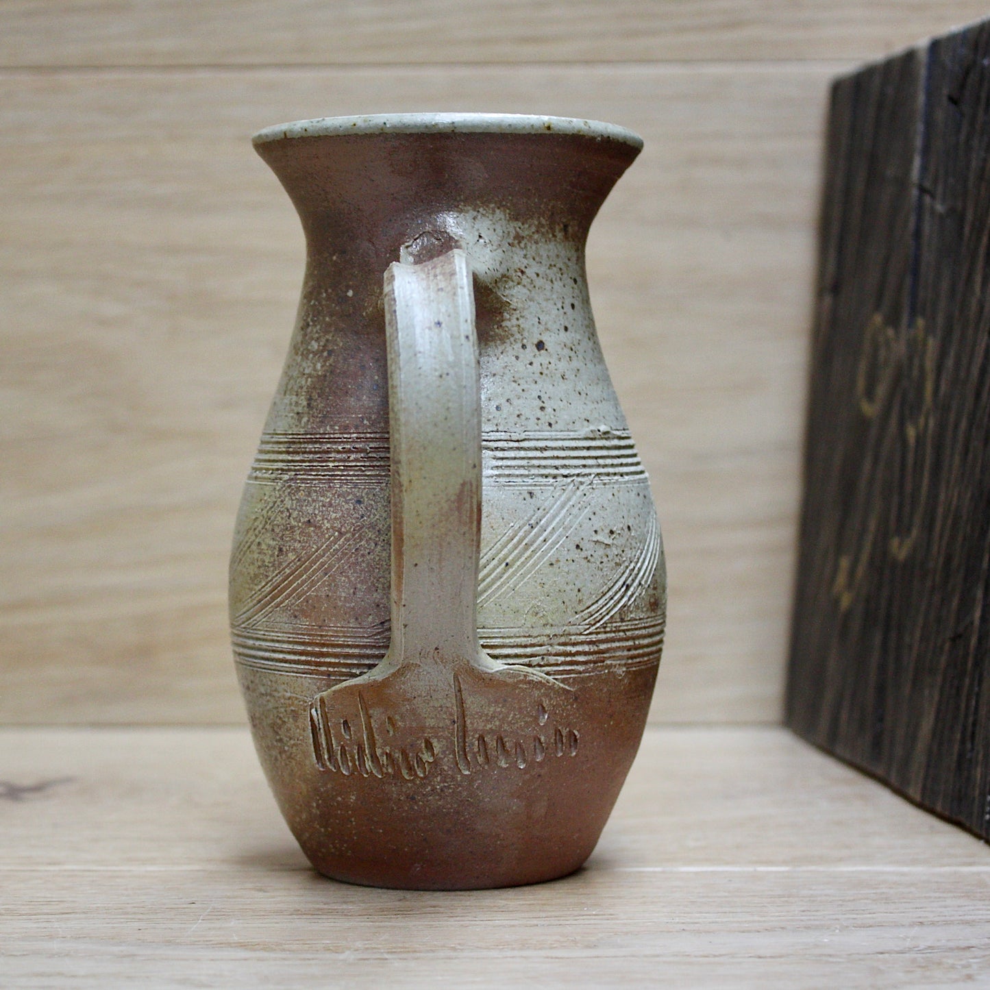 
                  
                    a studio pottery salt gaze jug.
                  
                