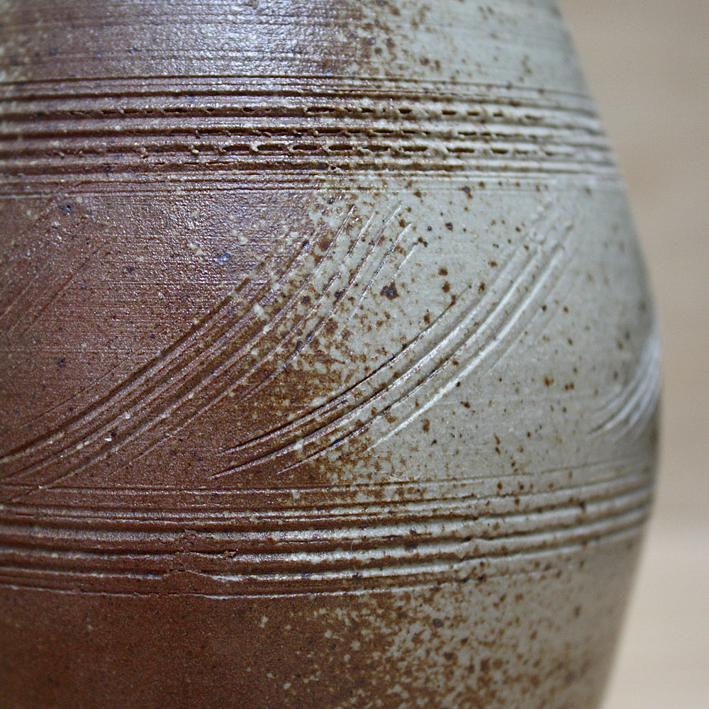 
                  
                    a studio pottery salt gaze jug.
                  
                