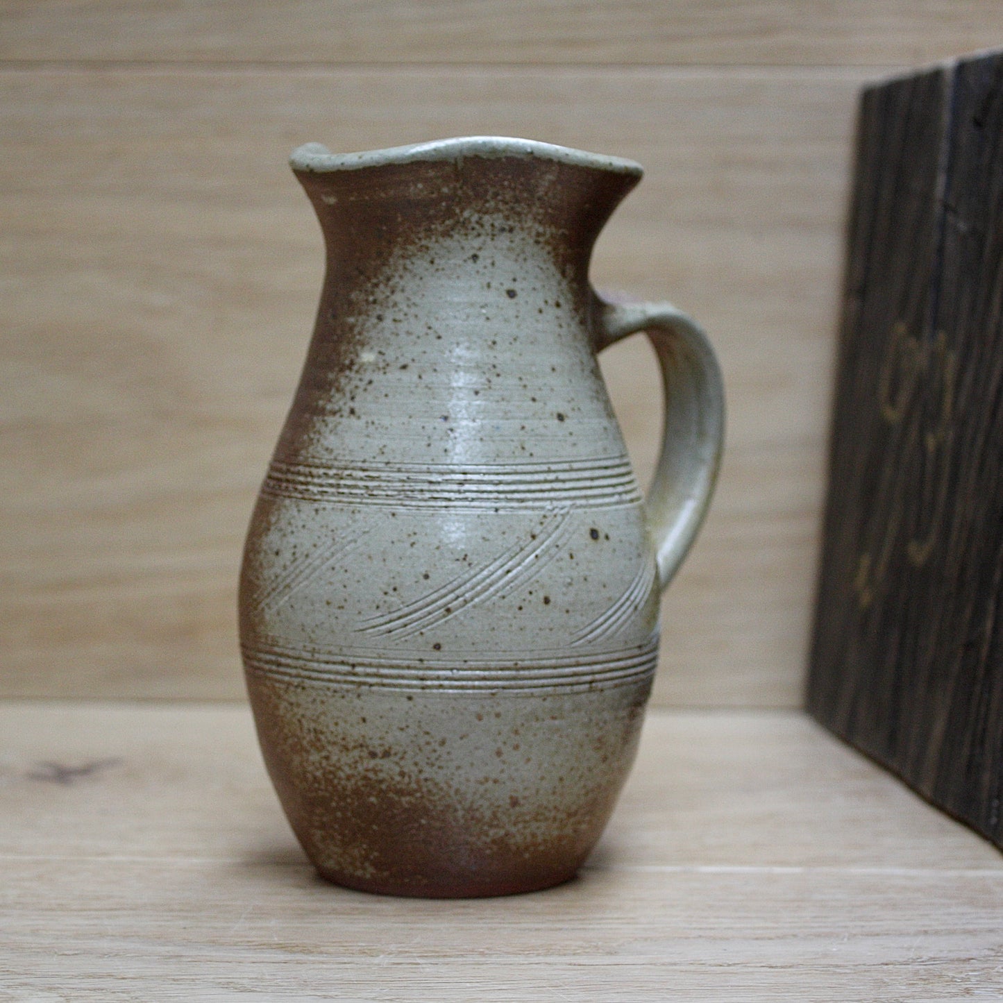 
                  
                    a studio pottery salt gaze jug.
                  
                